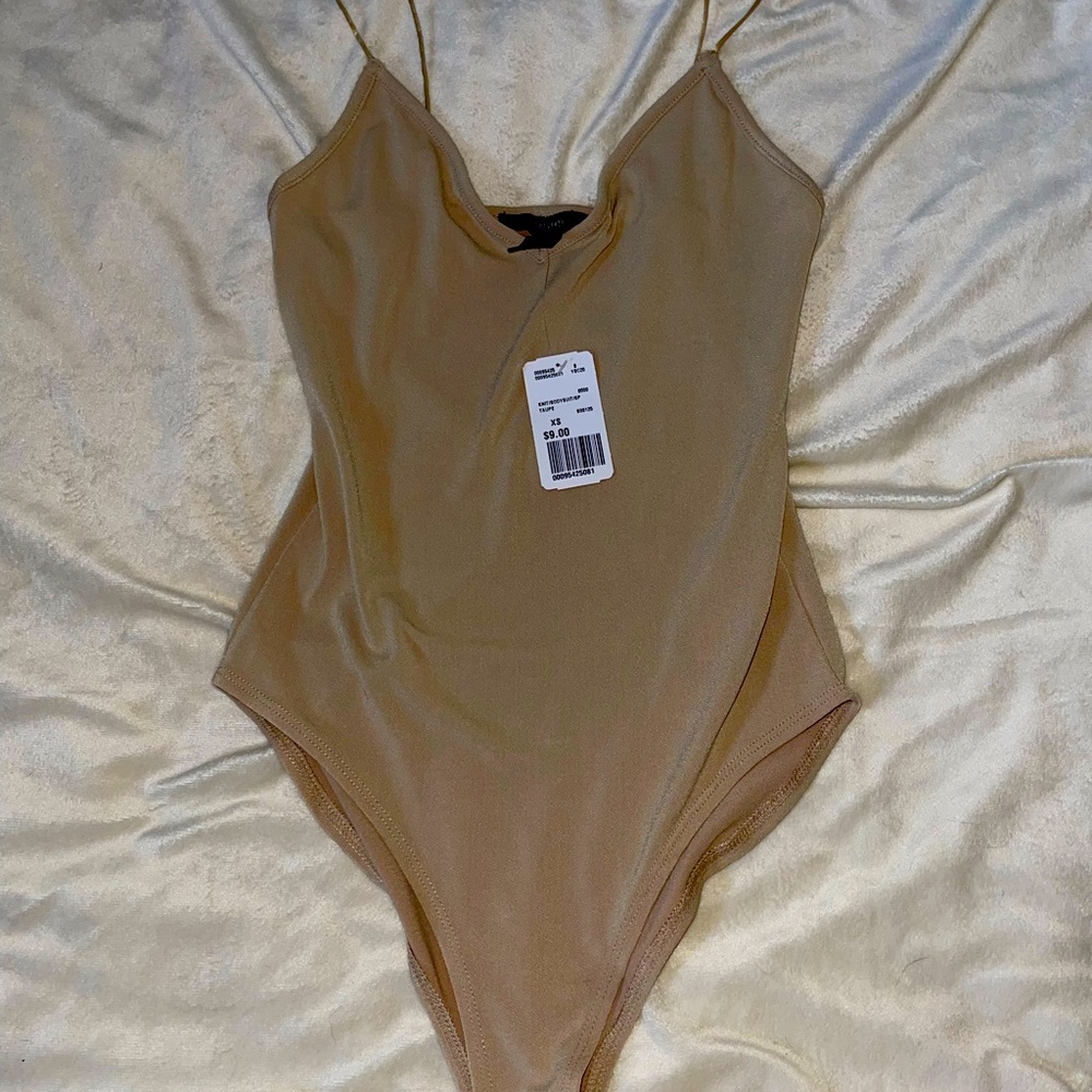Never worn nude body suit